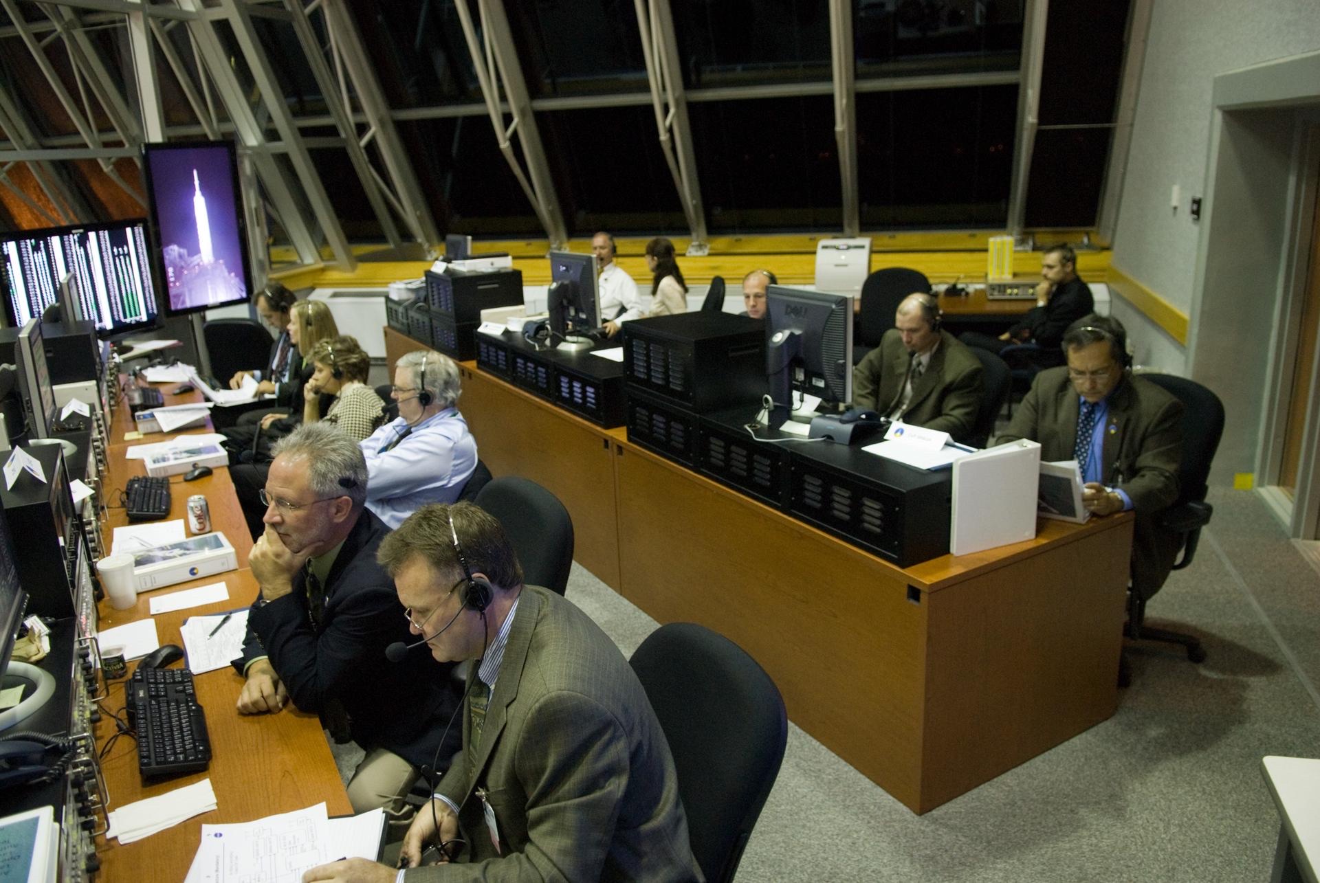 Launch authority team at consoles in the Young-Crippen Firing Room, Kennedy Space Center (NASA)